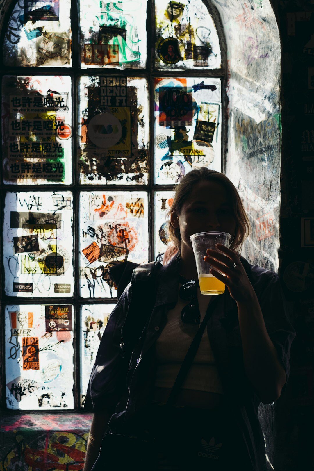 Portrait of a Danish female documentary photographer holding a camera
