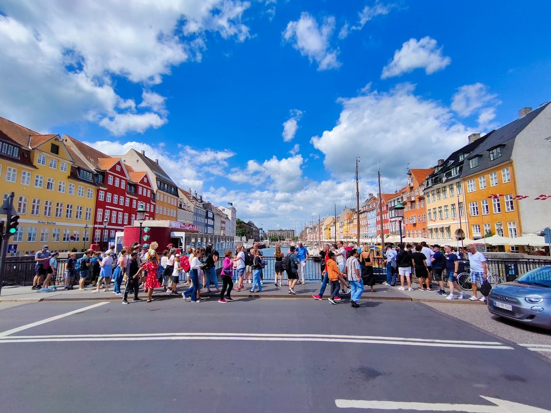 Multicultural community gathering in a Danish neighborhood courtyard