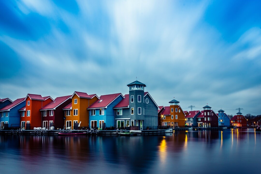 Traditional Danish fishing village with colorful houses along the water